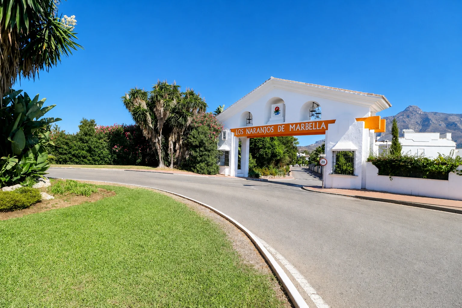 Entrance to Los Naranjos de Marbella with the mountain in the background