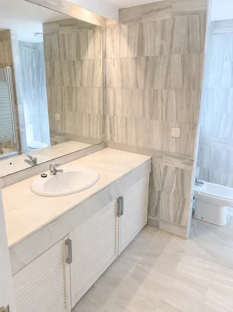 Marble main bathroom with shower