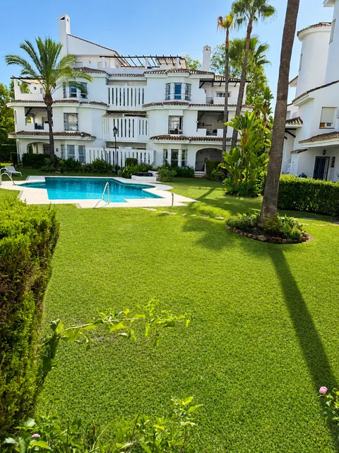 Communal gardens and swimming pool at Los Naranjos de Marbella